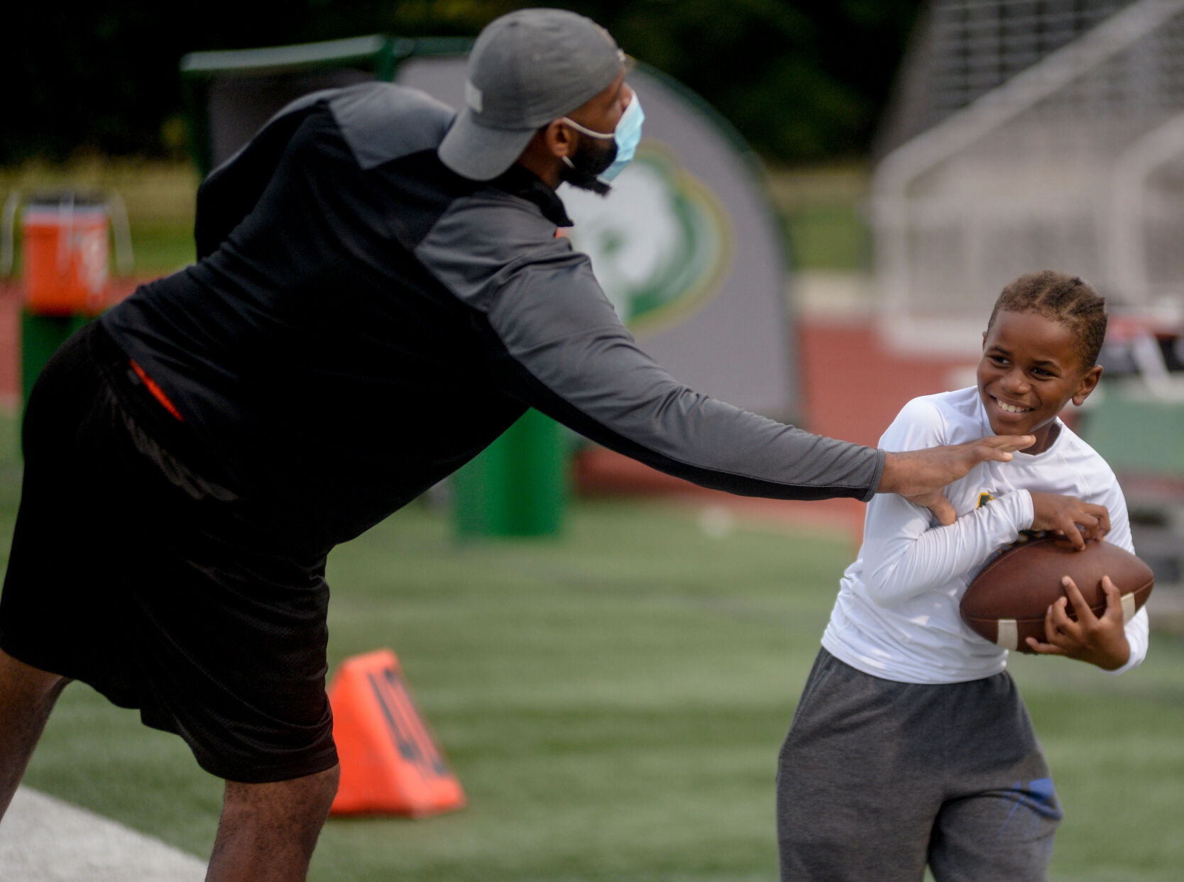 Rock Bridge defensive coach Shelton Bynum plays a quick pick up game